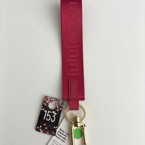 153,NWT Lululemon athletica Magenta Never Lost Keychain Gold Color Hardware